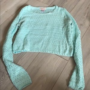 greenish teal sweater